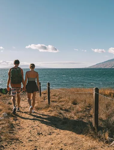 Maui island couple walking to the beach
