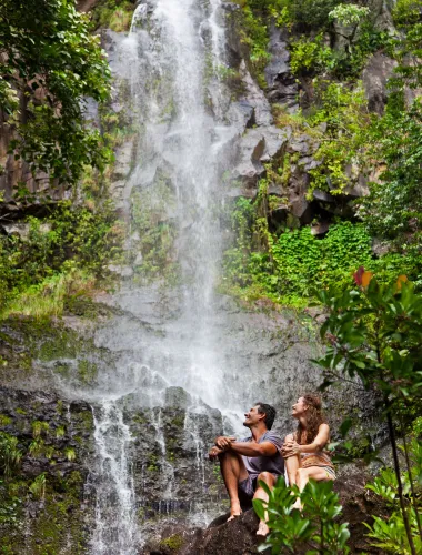 Travelers at waterfall near Hāna on Maui in Hawaiʻi