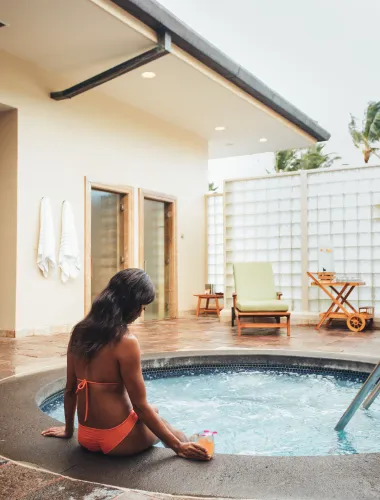 Woman in a hot tub at a resort spa on Kauaʻi in Hawaiʻi