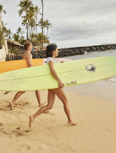 Surfers on an Oahu beach