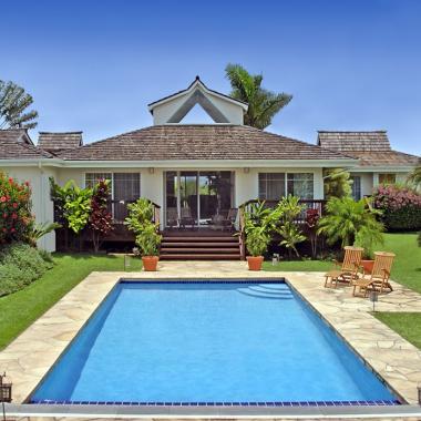 Pool with house in back ground