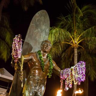 Statue of Duke Kahanamoku, father of modern surfing, on Kuhio Beach, Waikiki