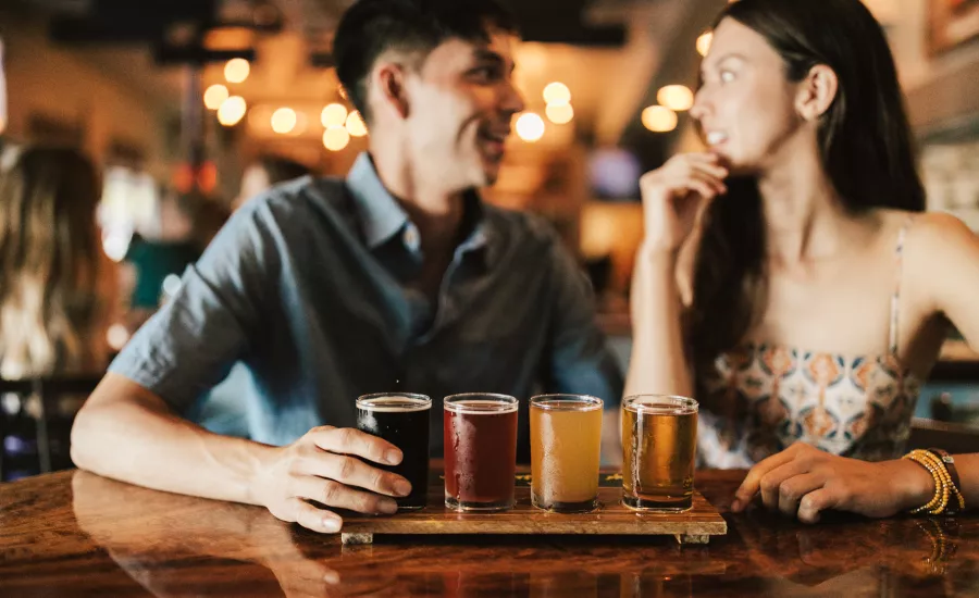 Couple enjoy pau hana at a local brewery